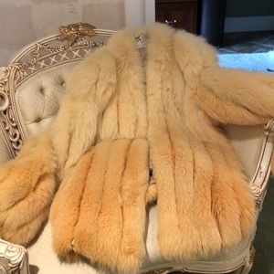 Cream colored fox fur jacket.